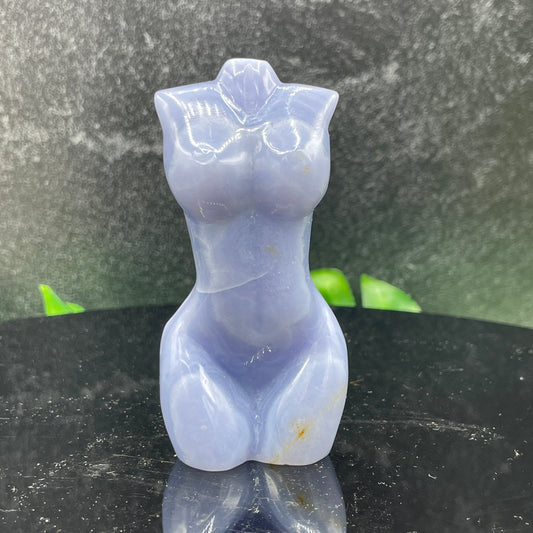 Blue lace agate goddess carving showing fine sky-blue and white lace banding