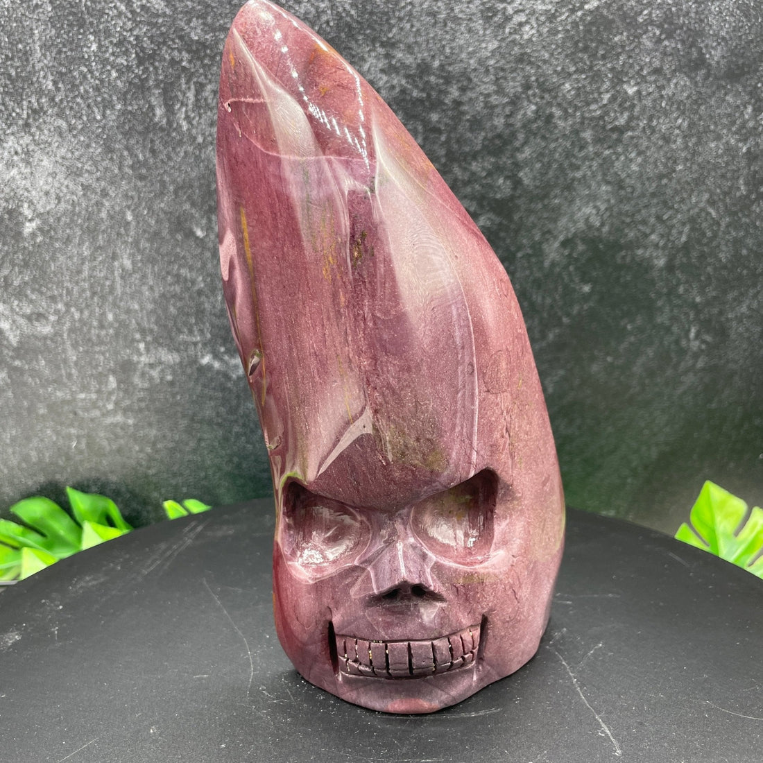 Purple mookaite flame skull carving from Western Australia, showing the rare mauve-purple variety
