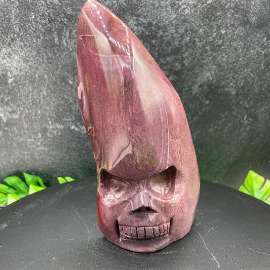 Purple mookaite flame skull carving from Western Australia, showing the rare mauve-purple variety