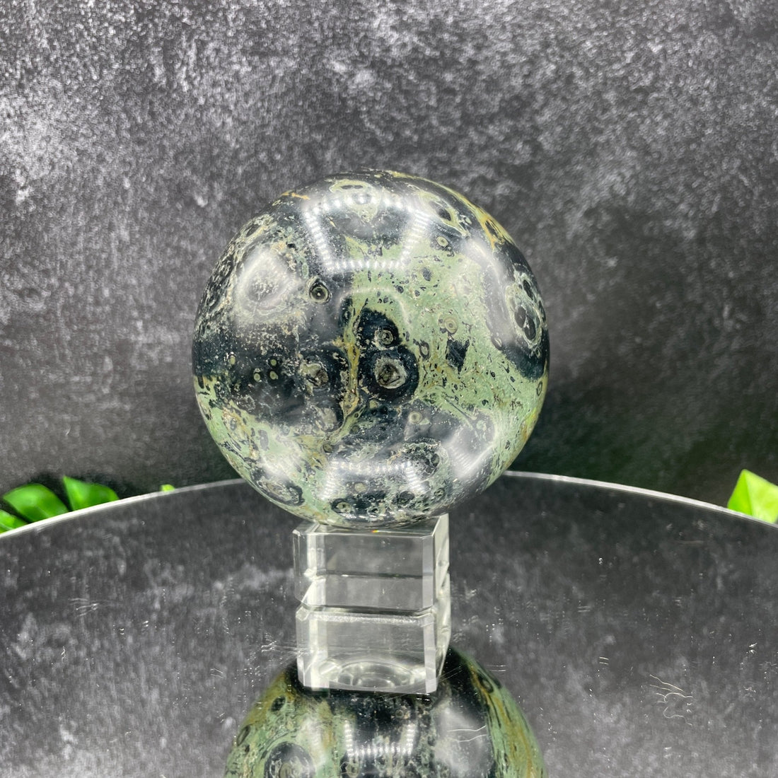 Kambaba jasper sphere showing the characteristic dark green orbicular eye patterns
