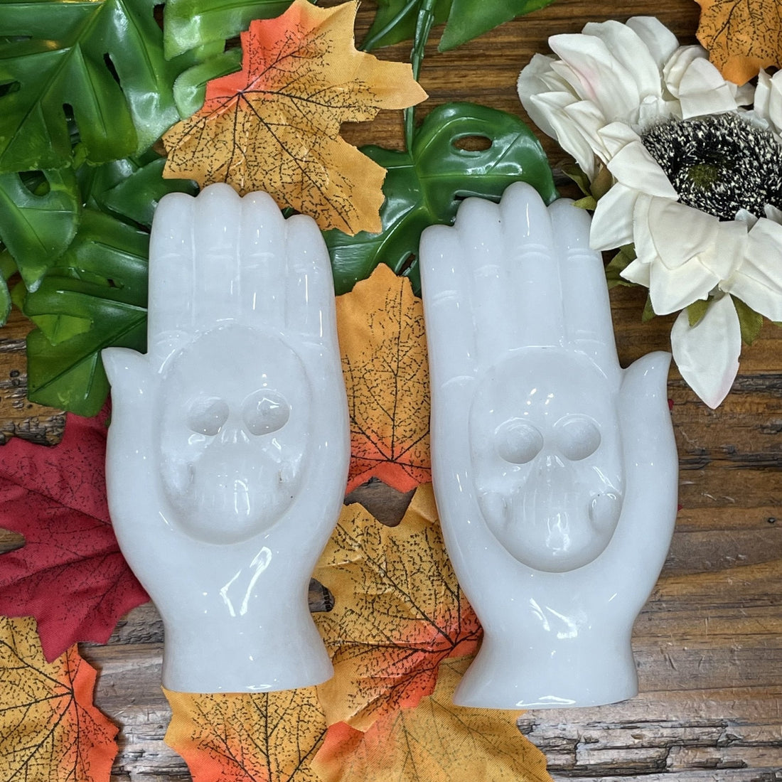 Carved white jade skull hand showing the toughness and detail jade carving allows
