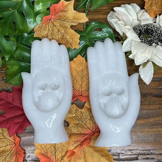 Carved white jade skull hand showing the toughness and detail jade carving allows
