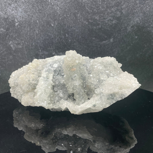 Stalactite apophyllite specimen from India showing glassy pyramid-tipped crystals