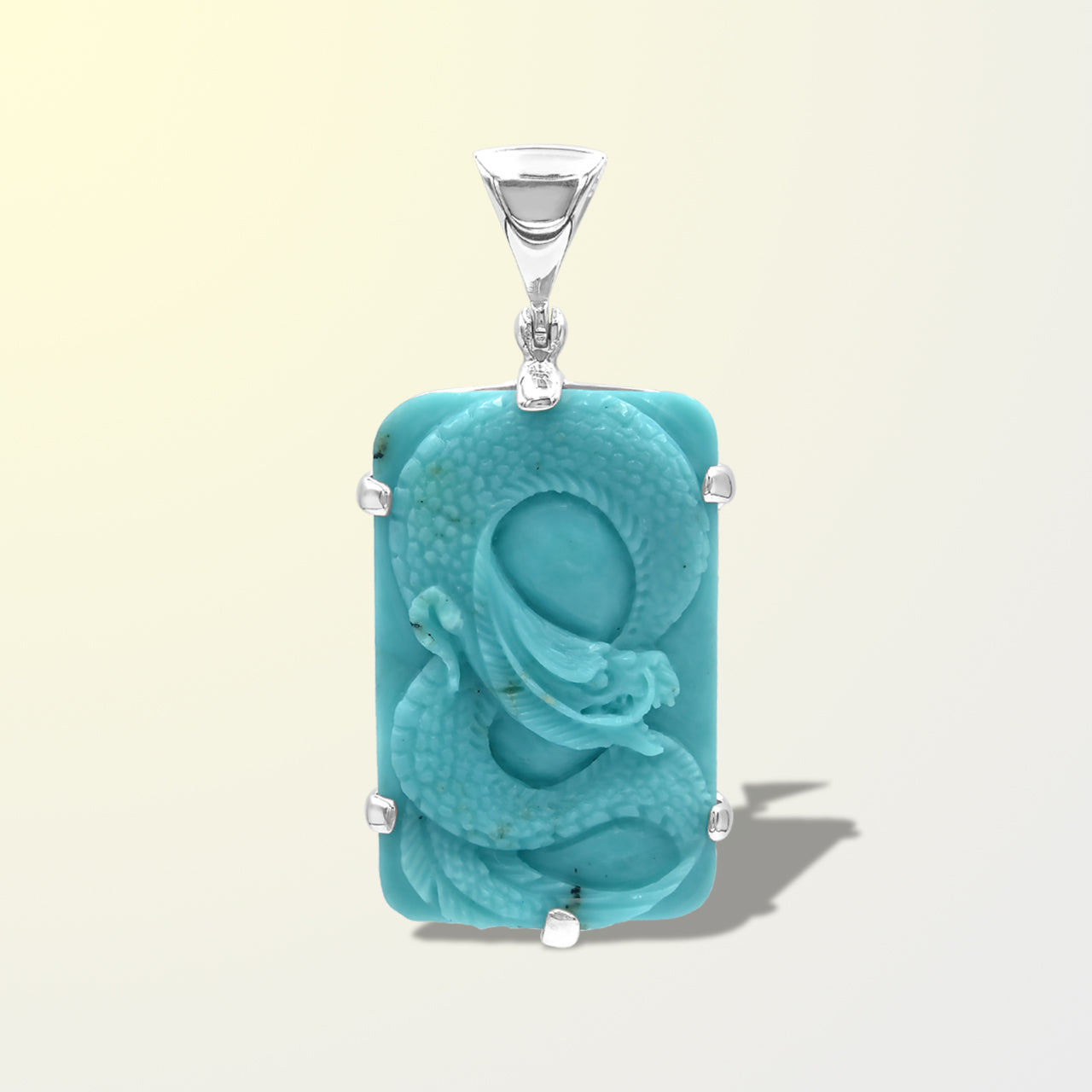 Starborn Carved Campitos Turquoise Dragon Pendant in Sterling Silver